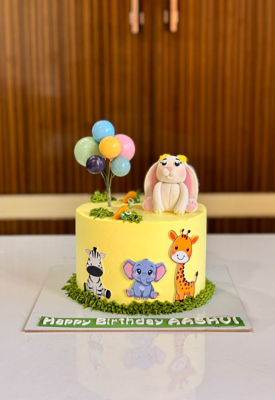 Colourful bunting first birthday cake