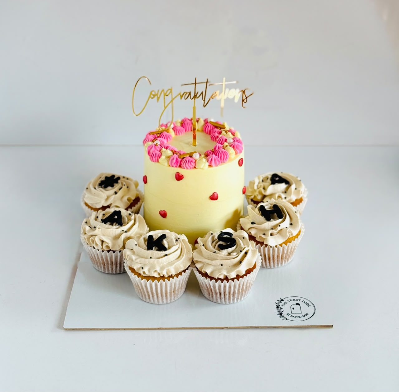 Bento cake with lettered cupcakes