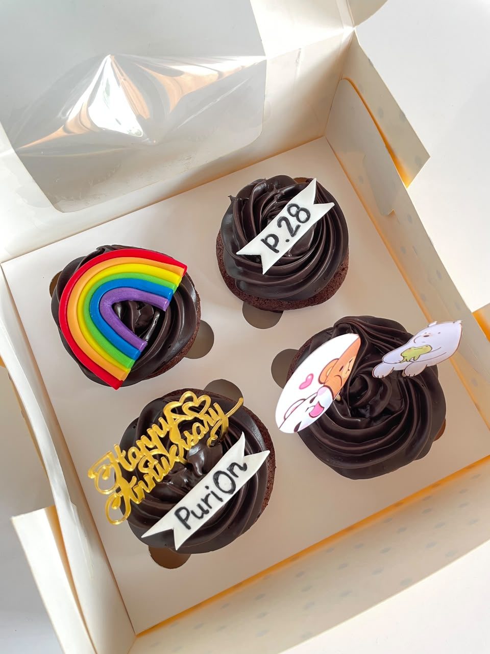 Chocolate cupcakes with custom toppers